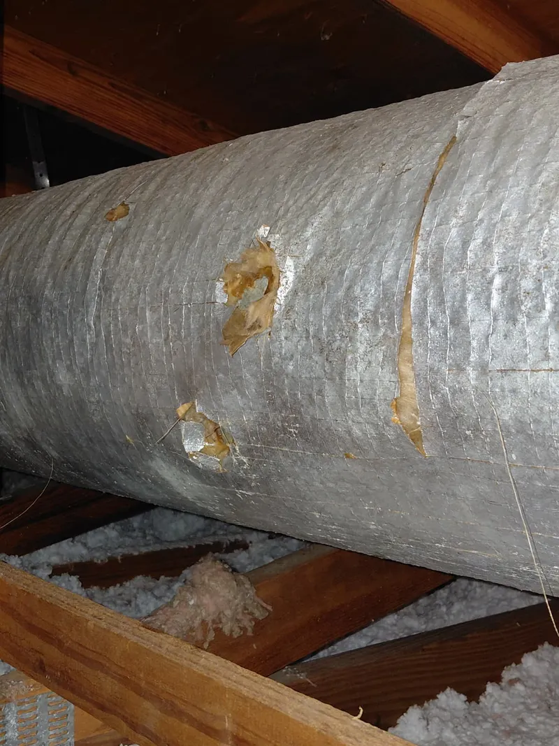 Close view of deteriorated exterior duct insulation